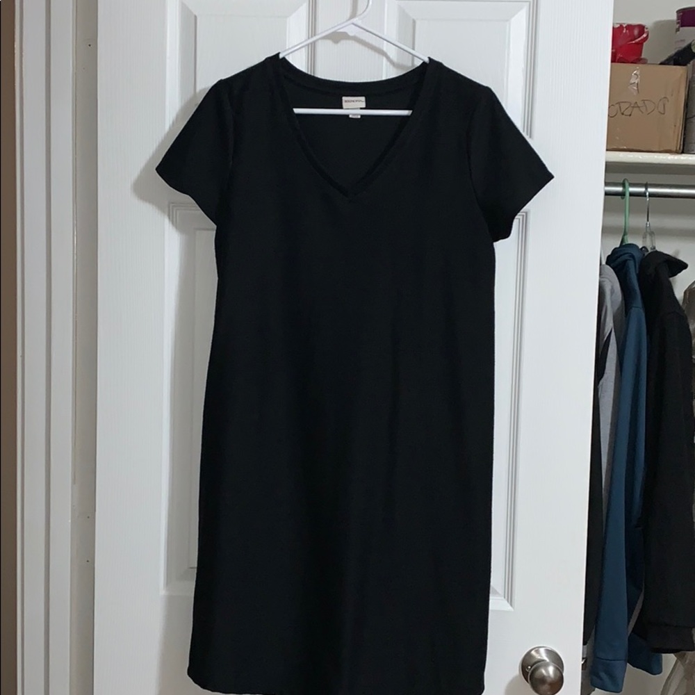 Knee length, v-neck, short sleeved black dress